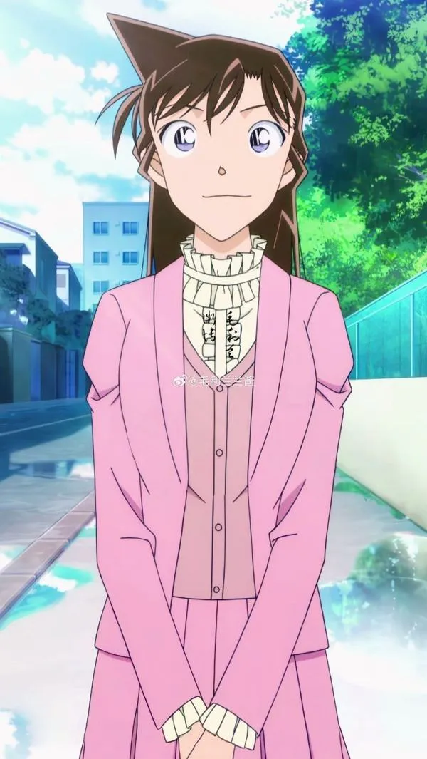 Hình nền điện thoại Ran Mori áo khoác hồng, váy xanh, nền sông trời lạnh, bố cục thoáng, nhìn rất êm