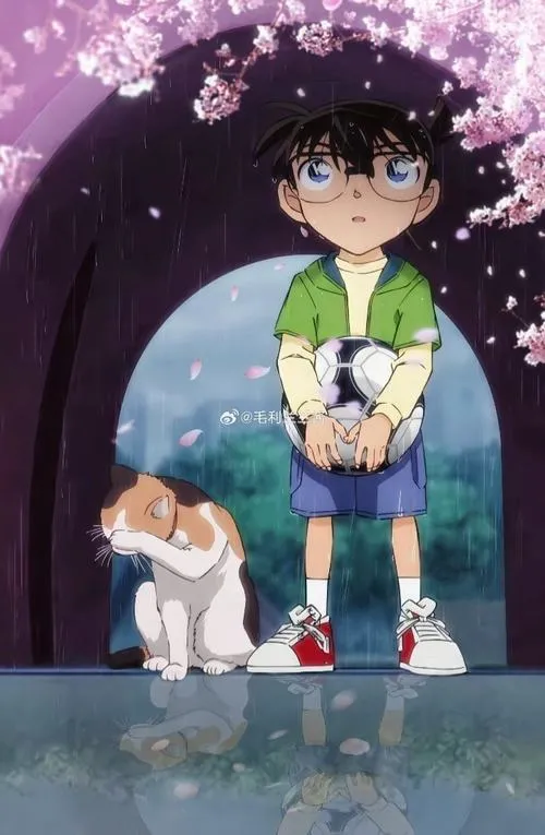 Ảnh Conan ngồi xổm trên nền gỗ, giày trắng đỏ, tư thế ngại ngùng rất cưng