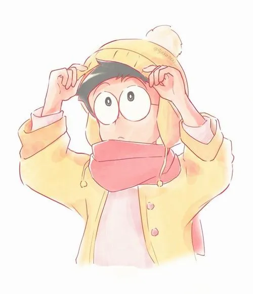 Ảnh Nobita trùm áo vàng, hai tay che đầu, biểu cảm ngại ngùng cực đáng yêu