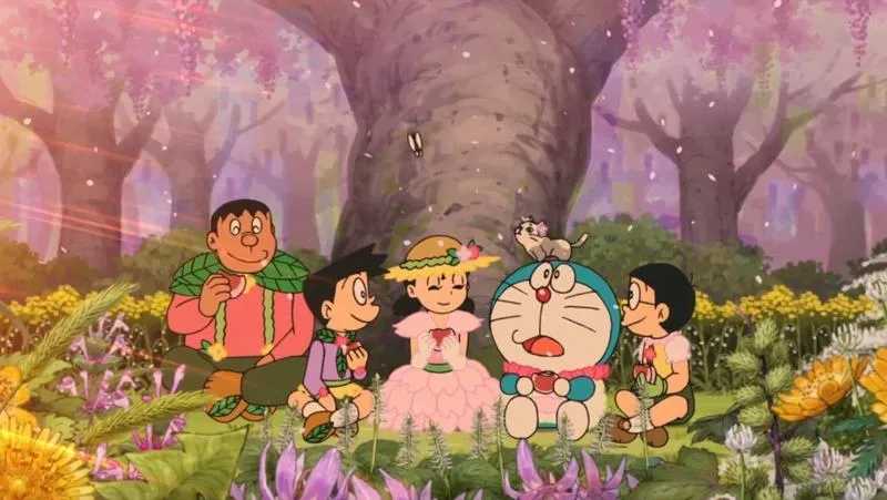 Hình nền Đô Rê Mon picnic dưới hoa anh đào, cả nhóm ngồi quây quần, tông hồng dịu mắt.