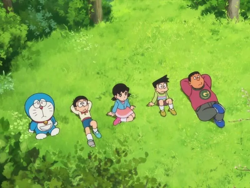 Tải ảnh Doraemon cùng lũ trẻ chạy trên đồi cỏ, góc nhìn xa, cảm giác tự do và vui.