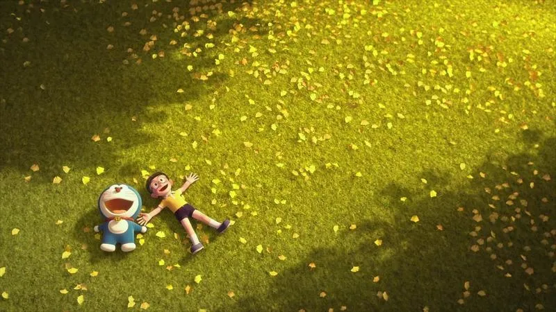 Hình nền Doremon và Nobita nằm trên bãi cỏ, ánh đom đóm lấp lánh, cảm giác chữa lành.